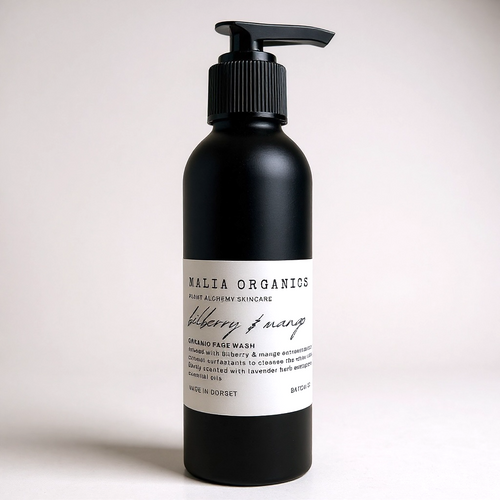 Black bottle of Malia Organics  Bilberry and Mango Facial Wash skincare product on a light background